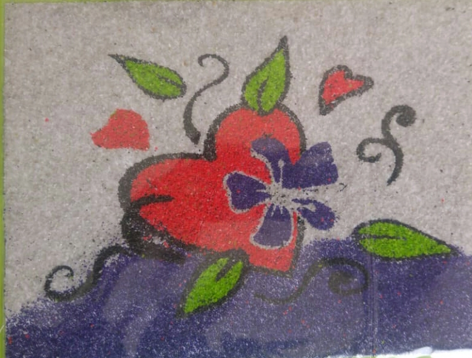 Moments Veranstaltungsagentur -Sandbild mit Blumenmotiv im Detail